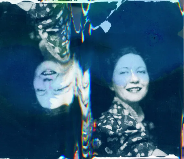 Mirrored double portrait in blue, photo collage by Samantha Hahn